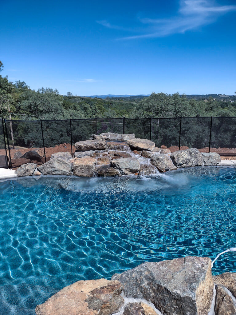 pool with natural rock waterfall