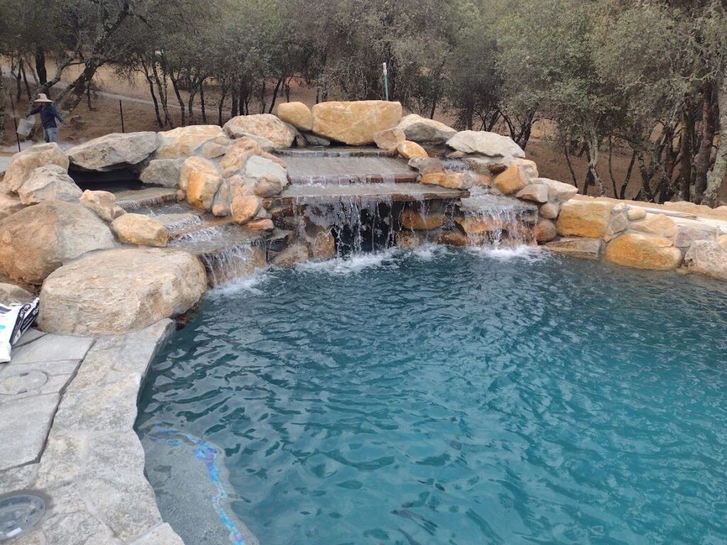 Pool with natural rock waterfall