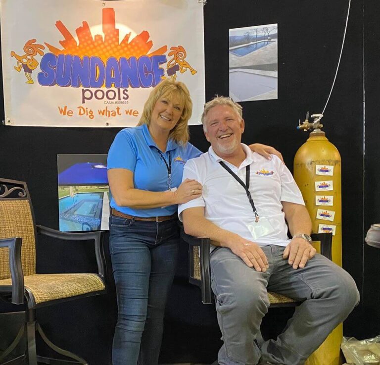 Melissa and Joe owners of Sundance Pools smiling at tradeshow
